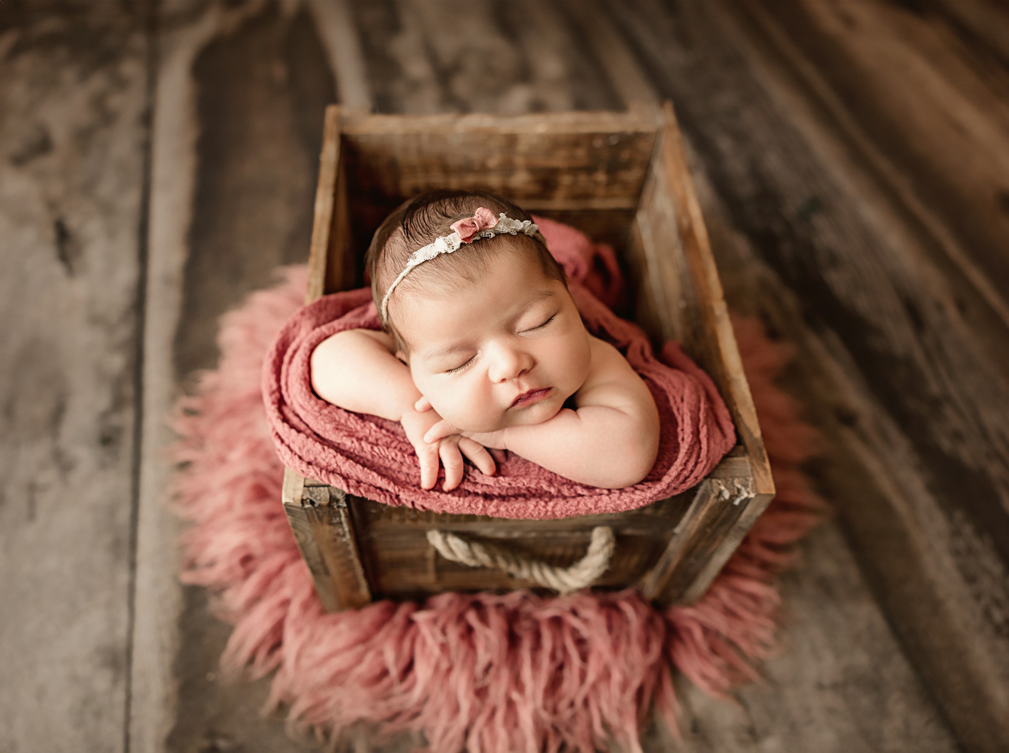 newborn photo with safety in mind and spotter nearby