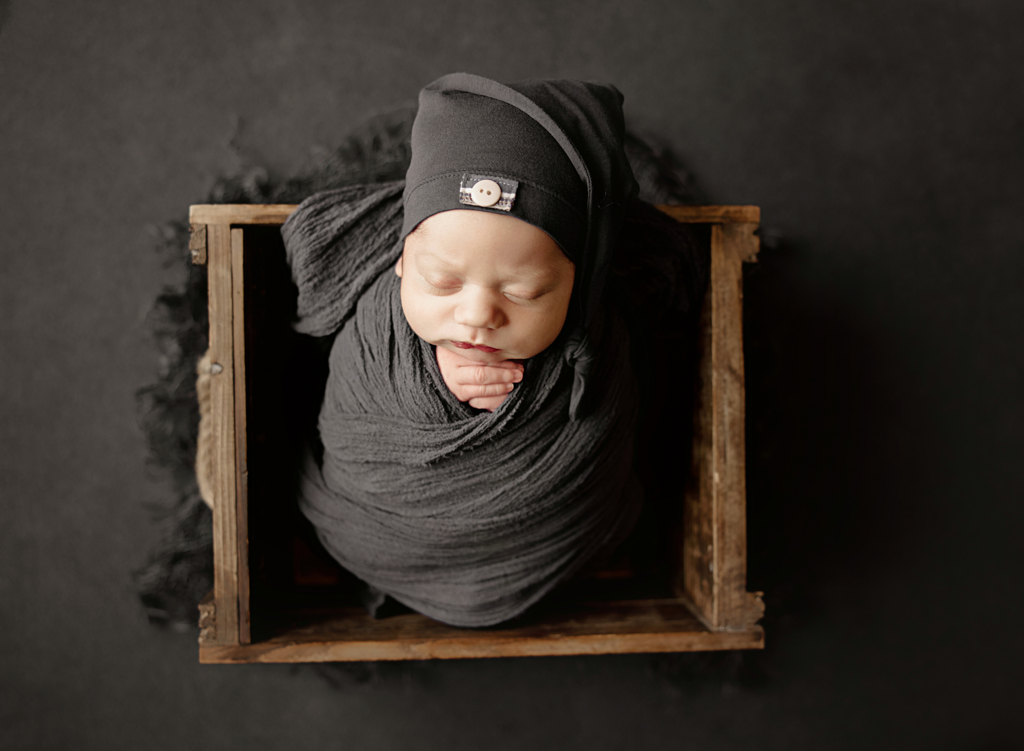 yuba city newborn photographer studio setup with props and wraps