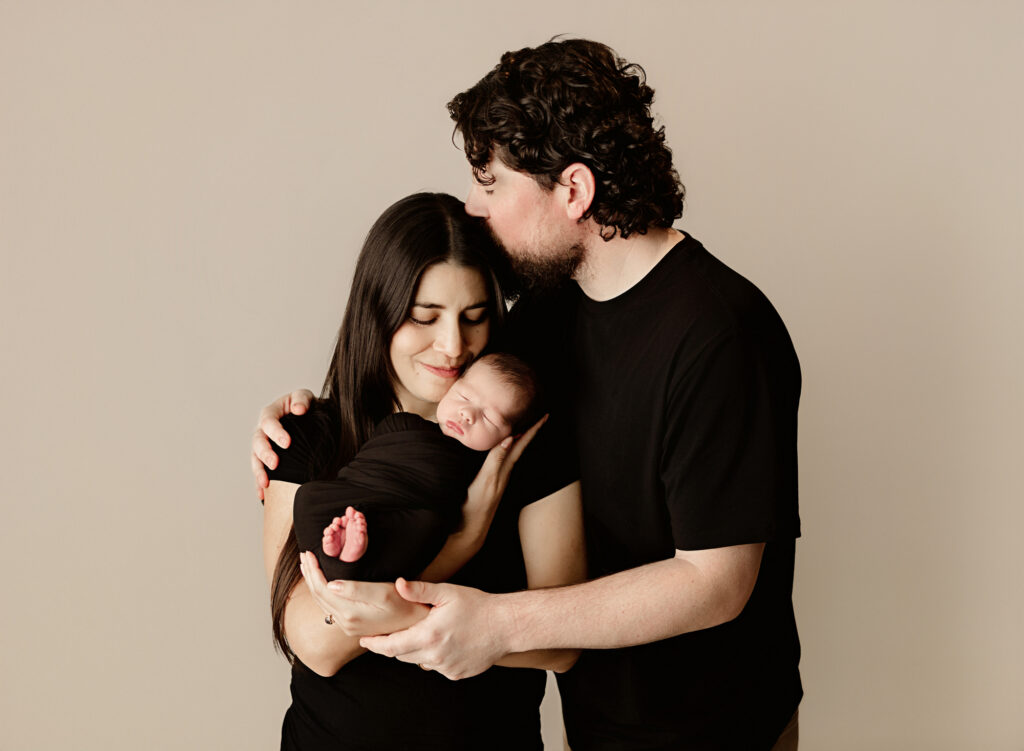 Chico, CA newborn photo session, baby with parents. 