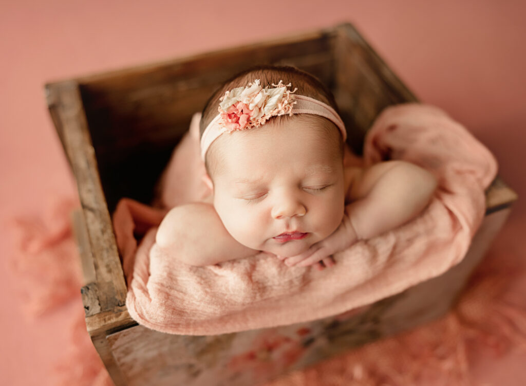 posed newborn baby in wrap yuba city newborn photography